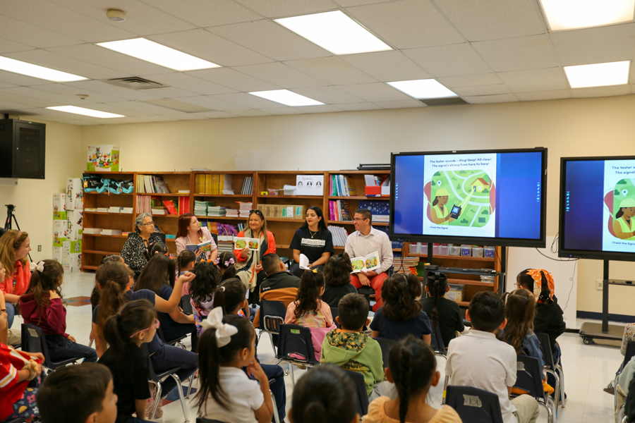 Readers hold up their copies as the fiber optic adventure continues.