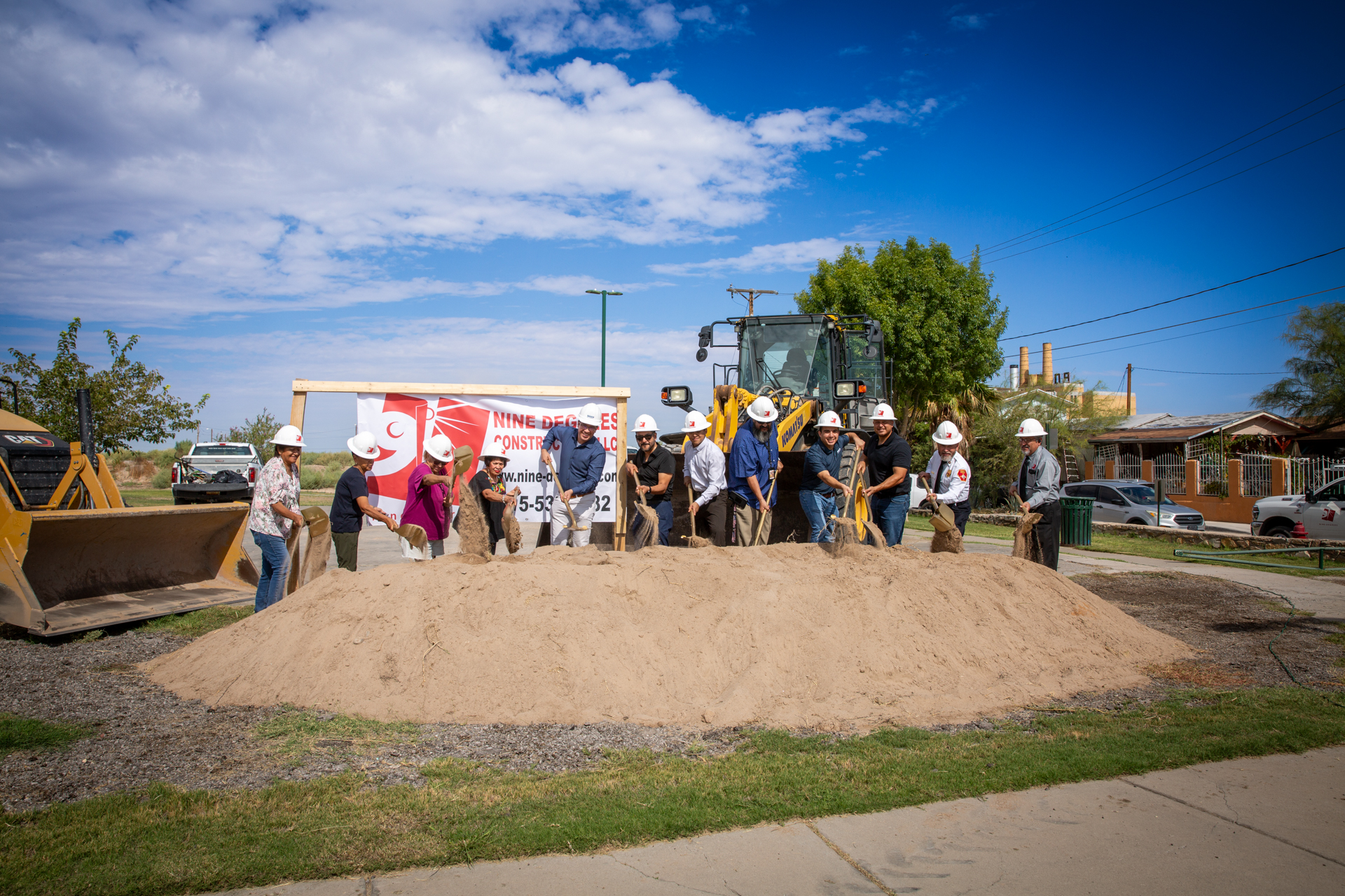 Officials, residents and the project team break ground with ceremonial shovels at Mender Park