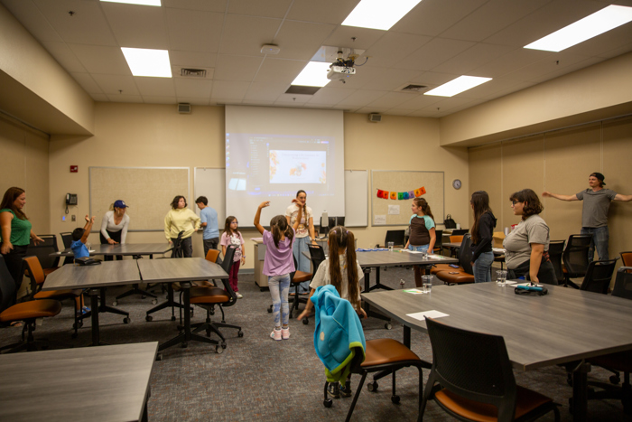 A wide view of the workshop room as the activity continues.