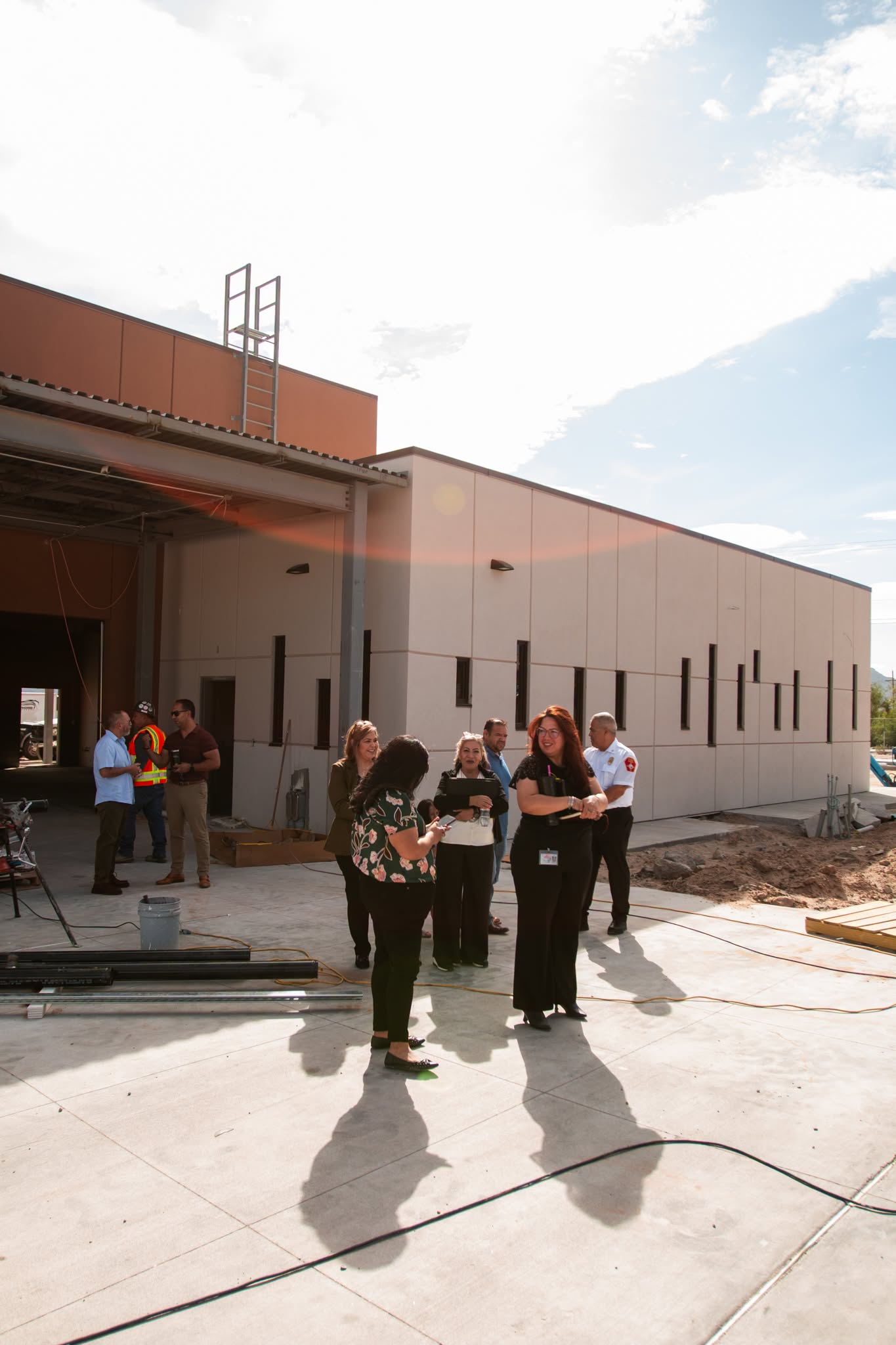Group photo of attendees at the construction site