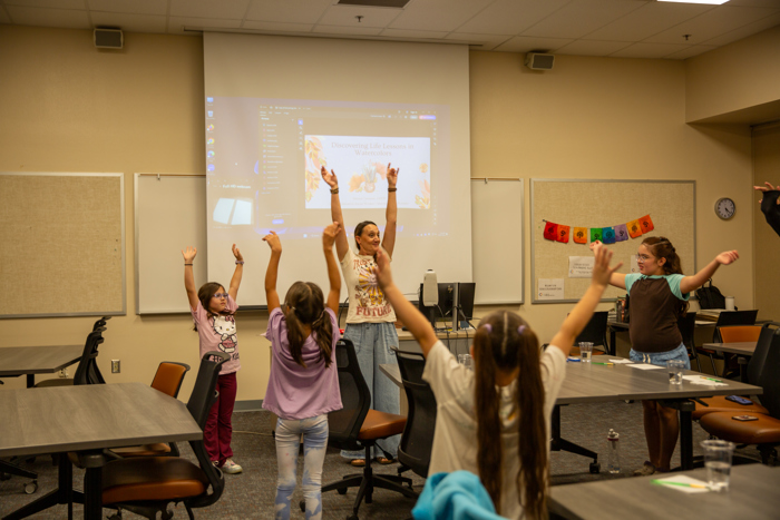 Young participants join in a workshop activity.
