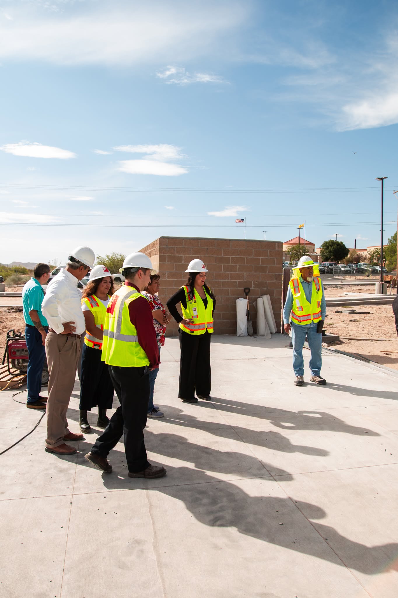 City leaders and community partners gather outside the new Casa de Peregrinos facility