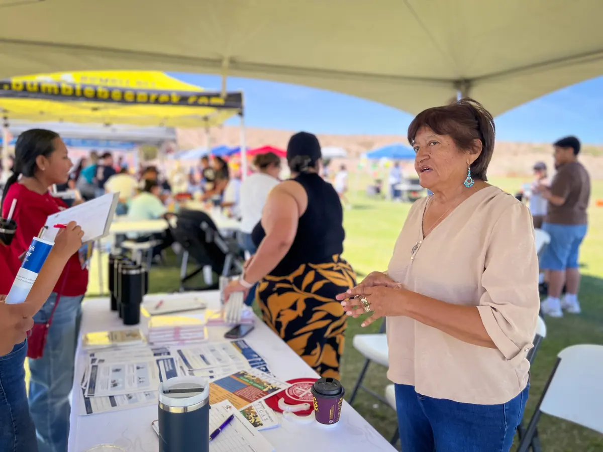 Councilors talk with residents at the Harvest of Happiness festival
