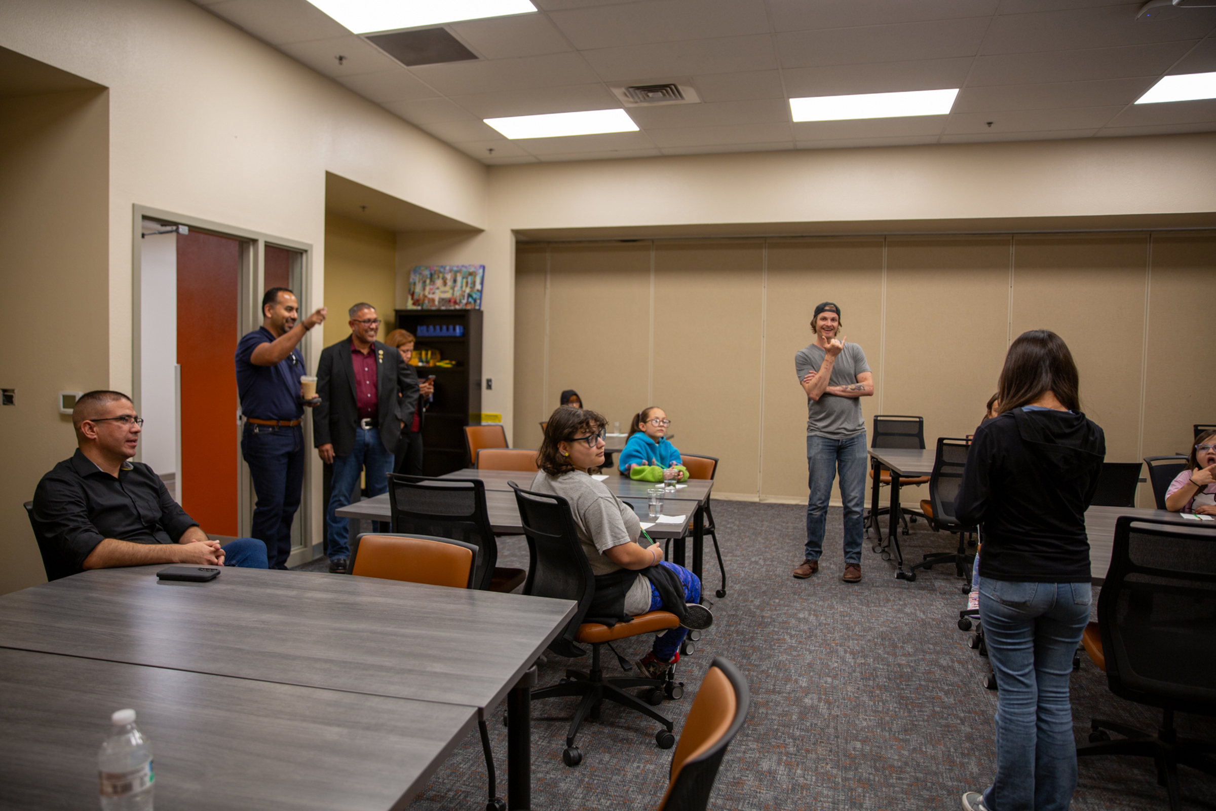 Council members and attendees gathered in the Kids Can workshop room.