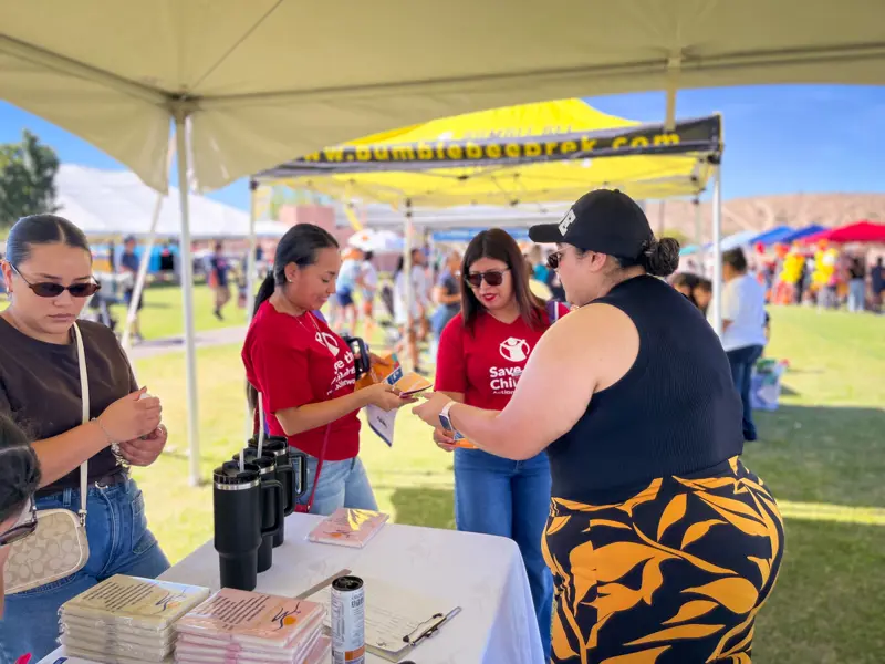 Families visit the Youth Center table
