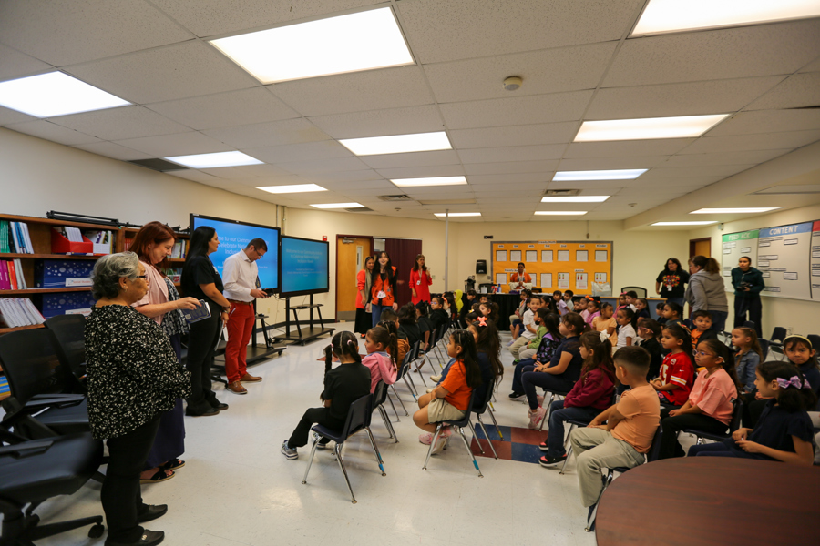 Readers and guests gather as Riverside Elementary students take their seats for story time.