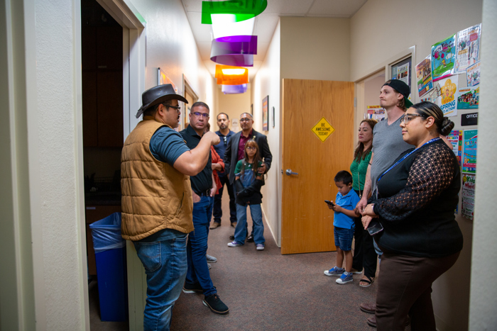 The tour continues down the hallway.