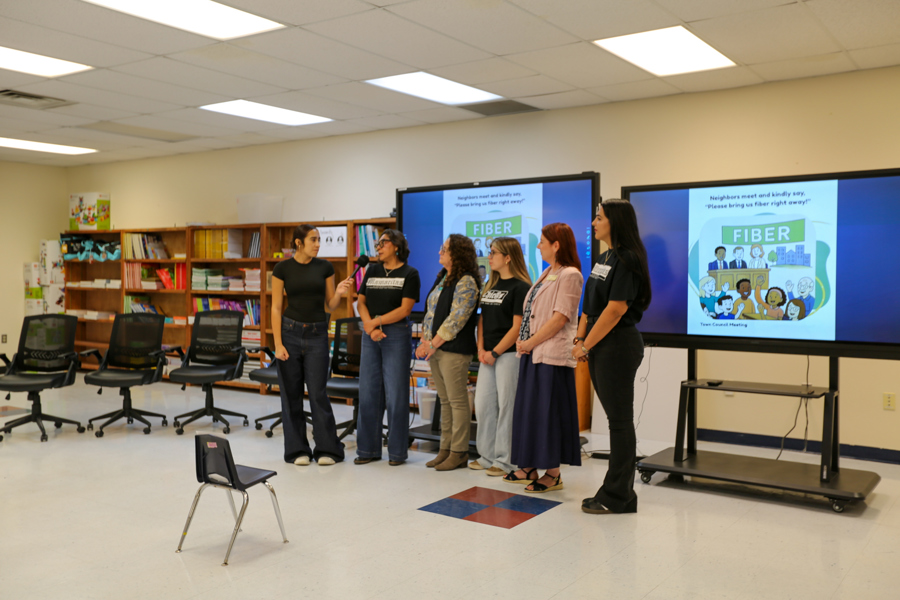 A Warrior Media reporter interviews members of the partner team.