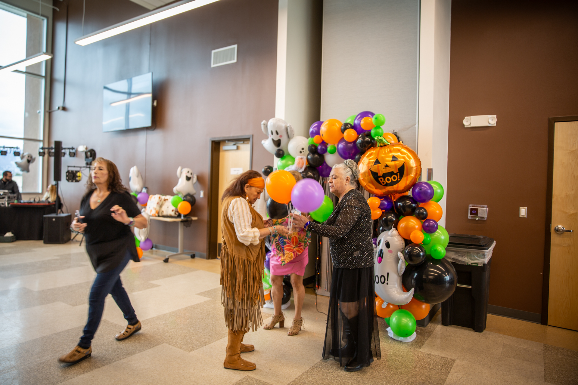 Guests dancing near the balloon arch