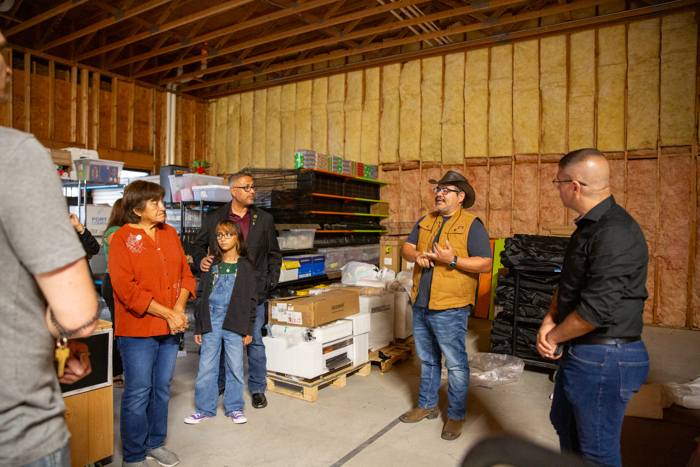 The group takes in the warehouse space.